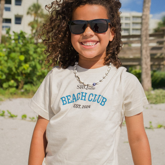 Lifestyle photo of the Youth SRQutie Beach Club Tee