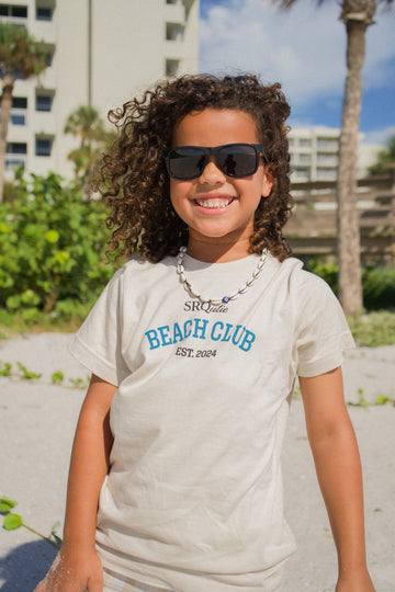 Lifestyle photo of the Youth SRQutie Beach Club Tee