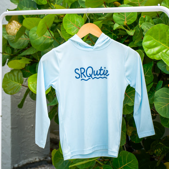 Front view of the Youth Sun SRQutie SPF Hooded Tee