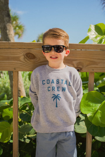 Lifestyle photo of the Youth Coastal Crew Sweatshirt