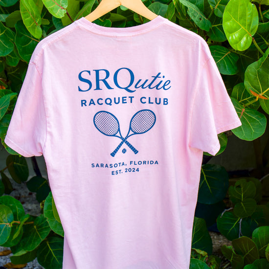 The women's Racquet Club SRQutie Tee in Cherry Blossom