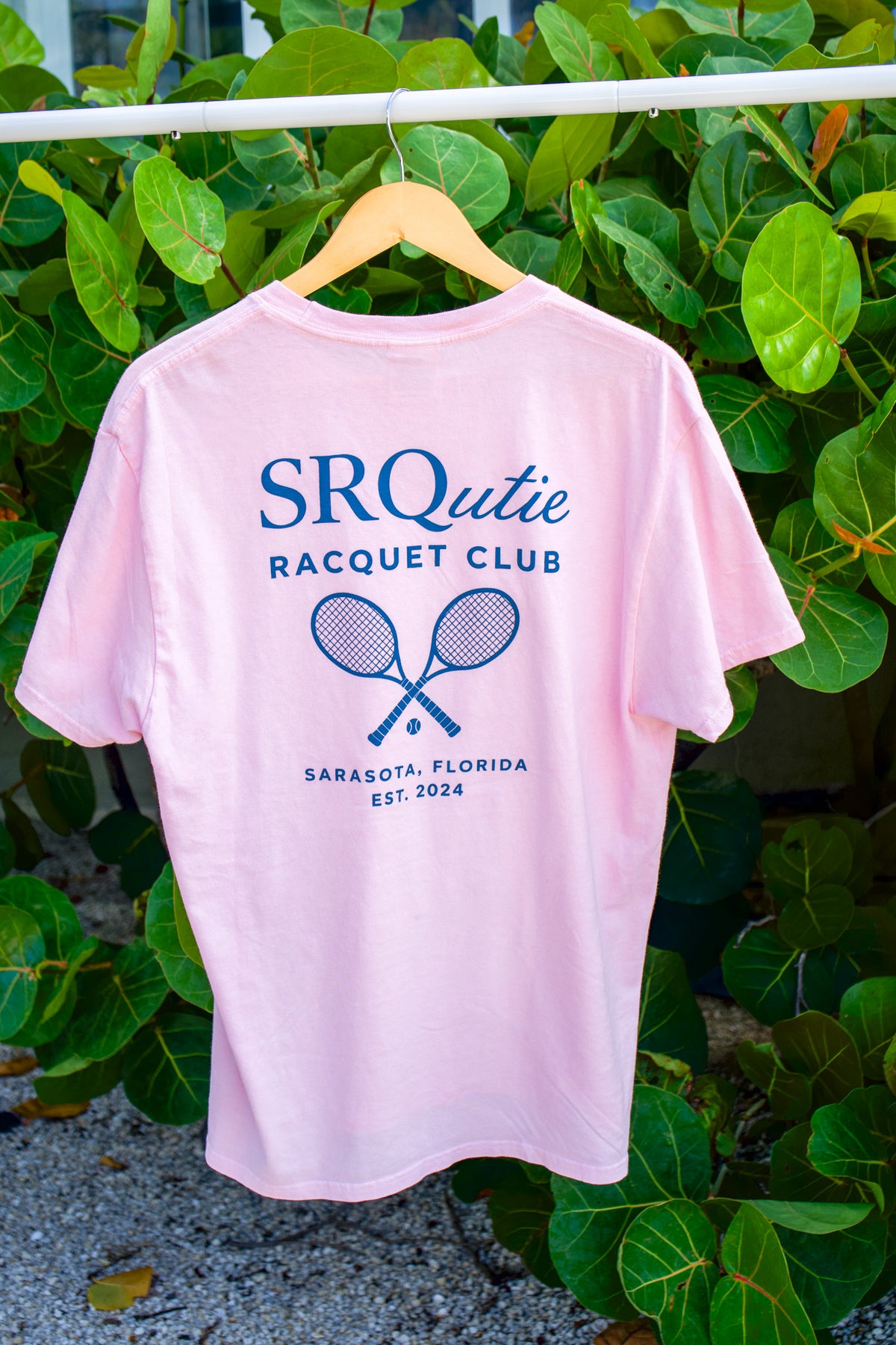 The women's Racquet Club SRQutie Tee in Cherry Blossom