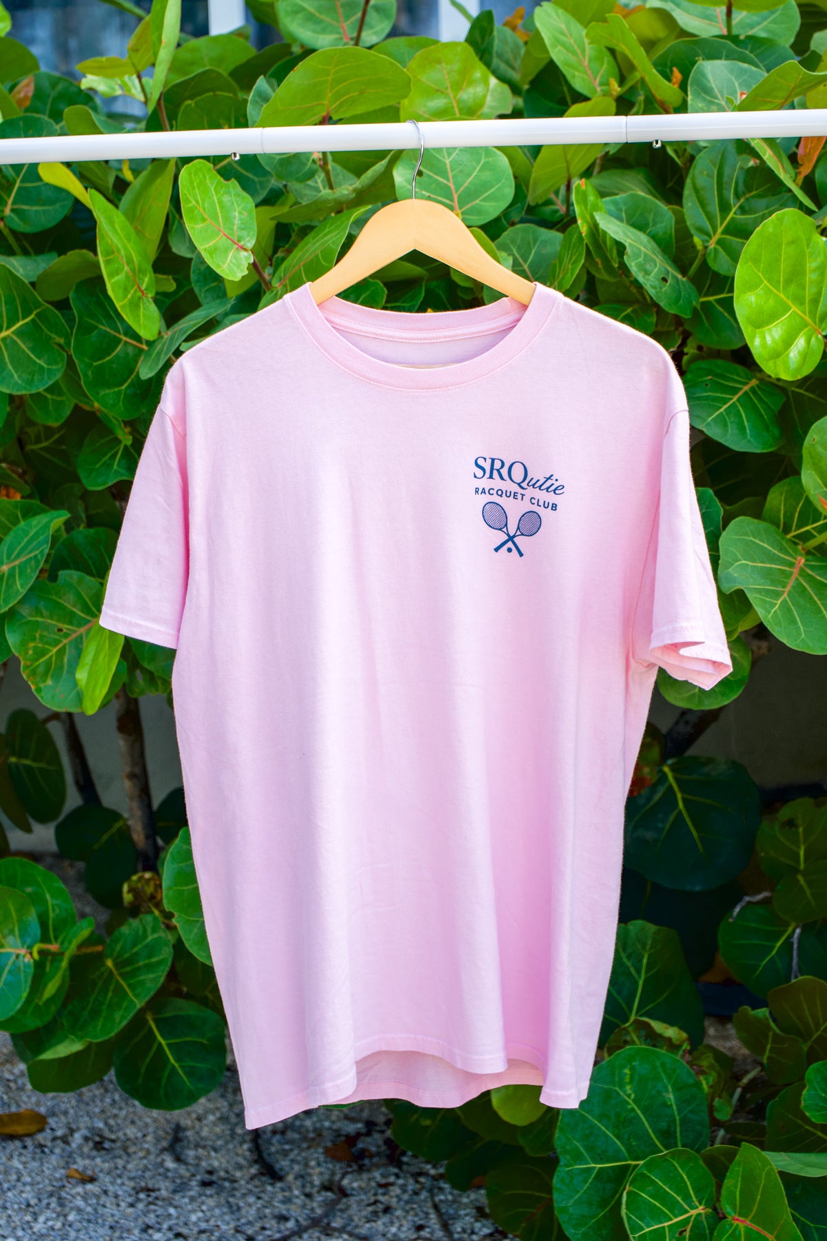 The women's Racquet Club SRQutie Tee in Cherry Blossom