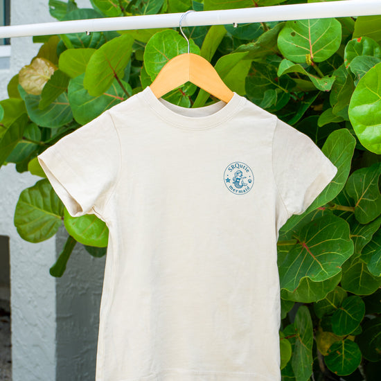 Front view of the Youth Mermaid SRQutie Tee in Natural