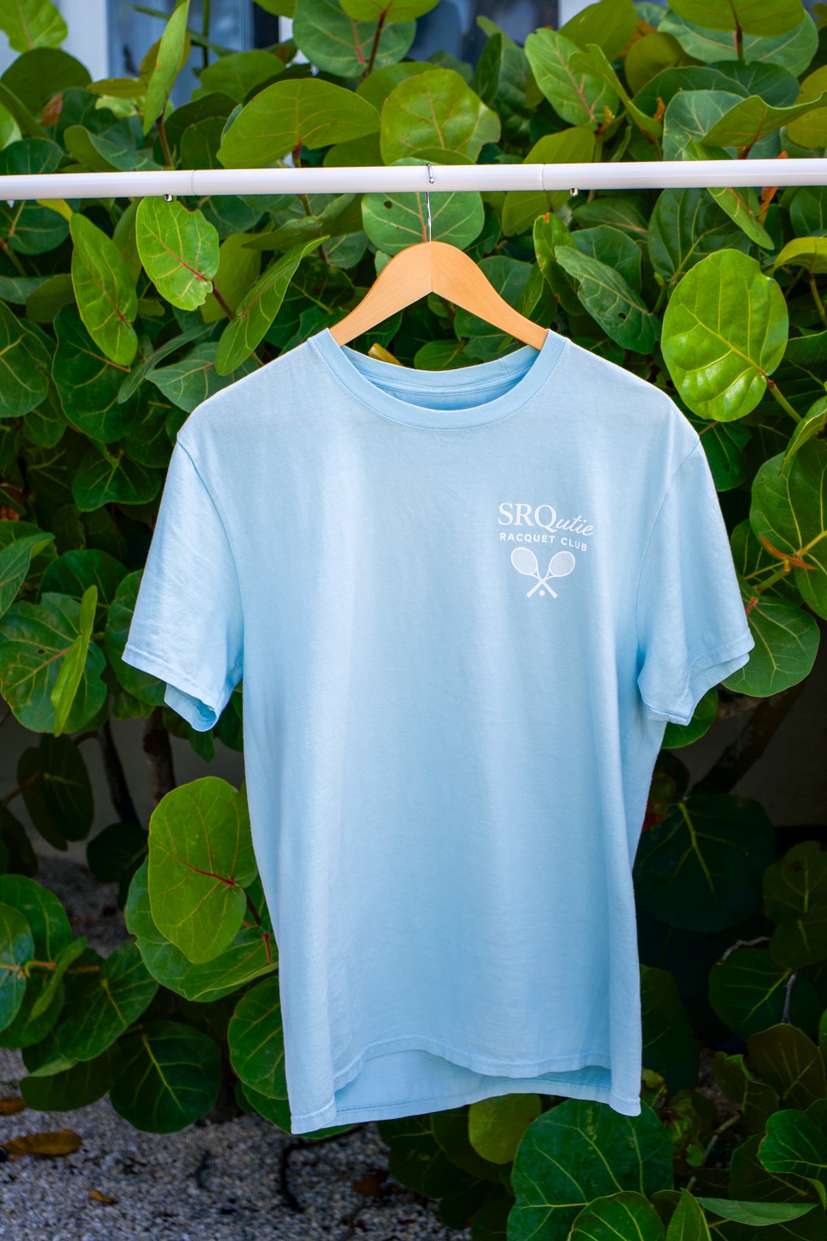 Front view of the Racquet Club SRQutie Tee in Glacier