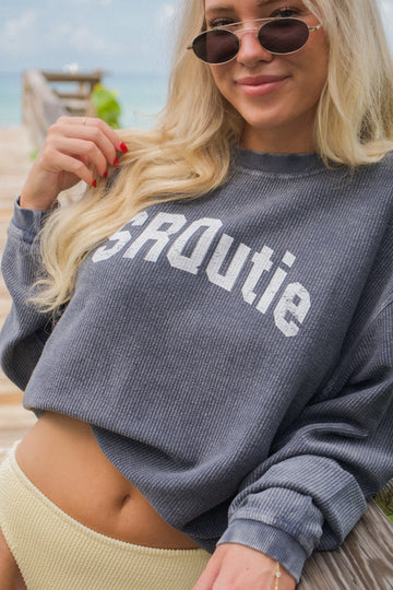 Lifestyle photo of the women's SRQutie Ribbed Varsity Sweatshirt