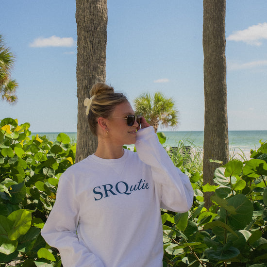 Lifestyle photo of the women's Signature SRQutie Sweatshirt