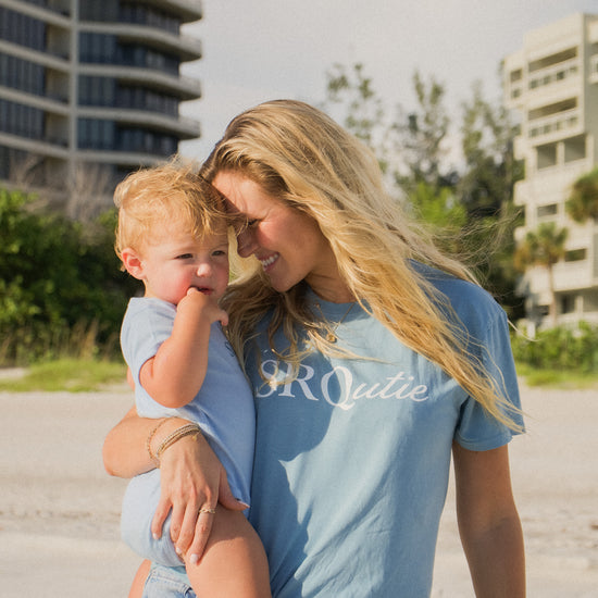 Lifestyle photo of the women's Signature SRQutie Tee