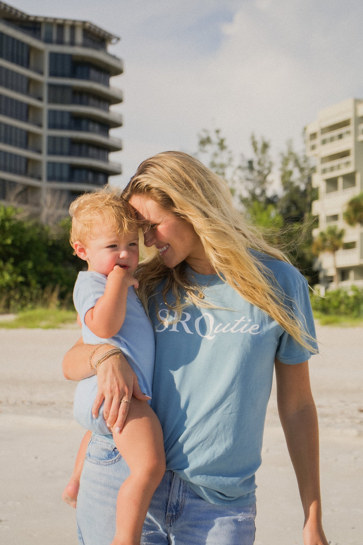 Lifestyle photo of the women's Signature SRQutie Tee