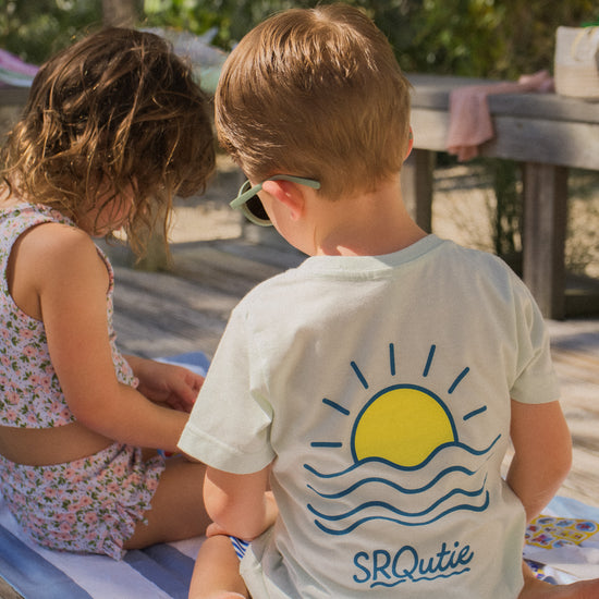 Lifestyle photo of the Youth Sunset SRQutie Tee